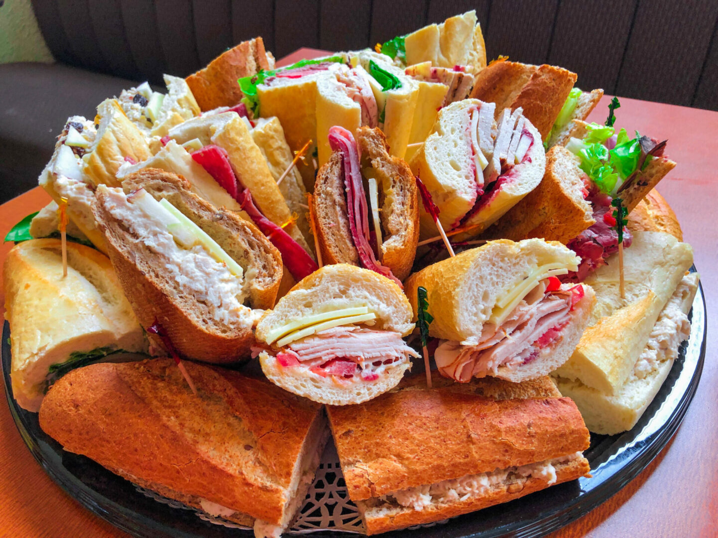 A platter of sandwiches on top of bread.